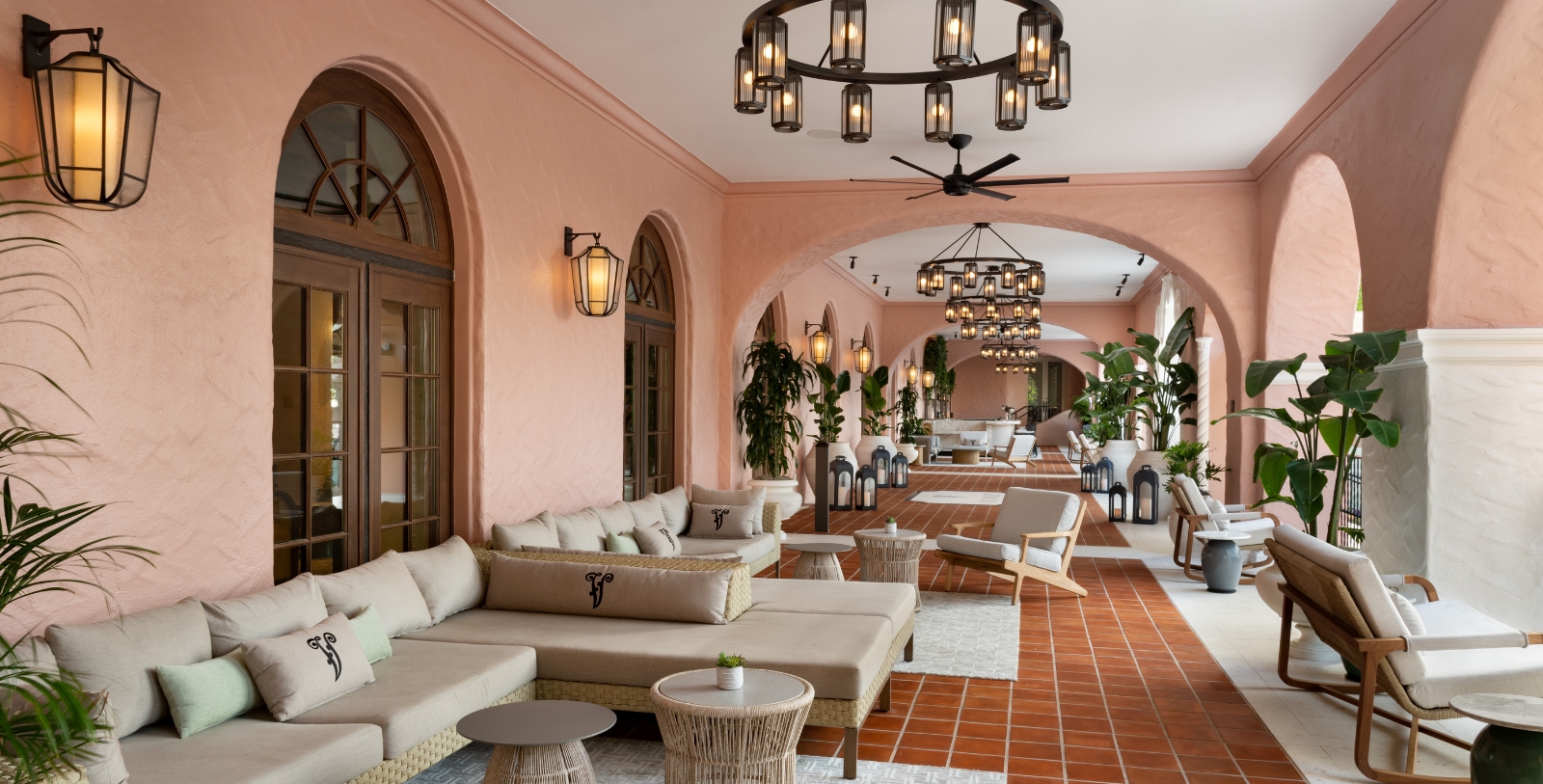 a large room with a large couch and chairs