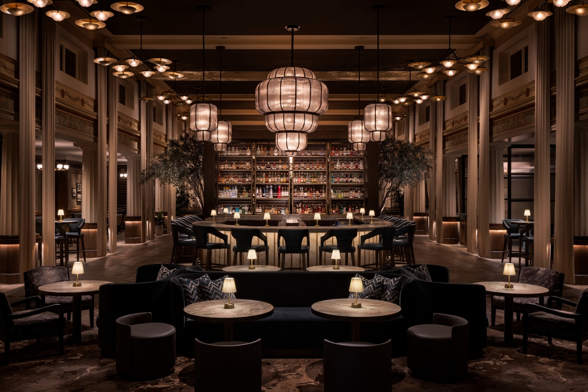 a room with tables and chairs and a shelf with lights
