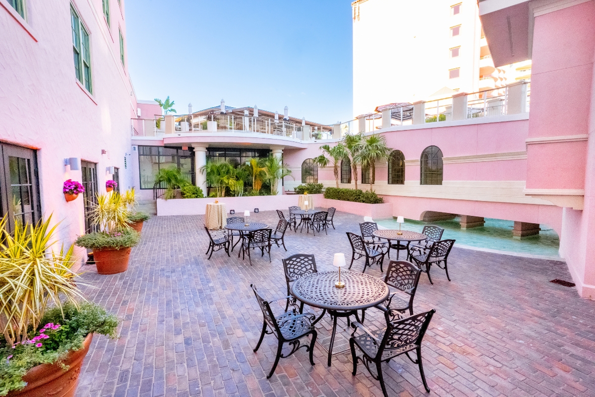 a patio with tables and chairs