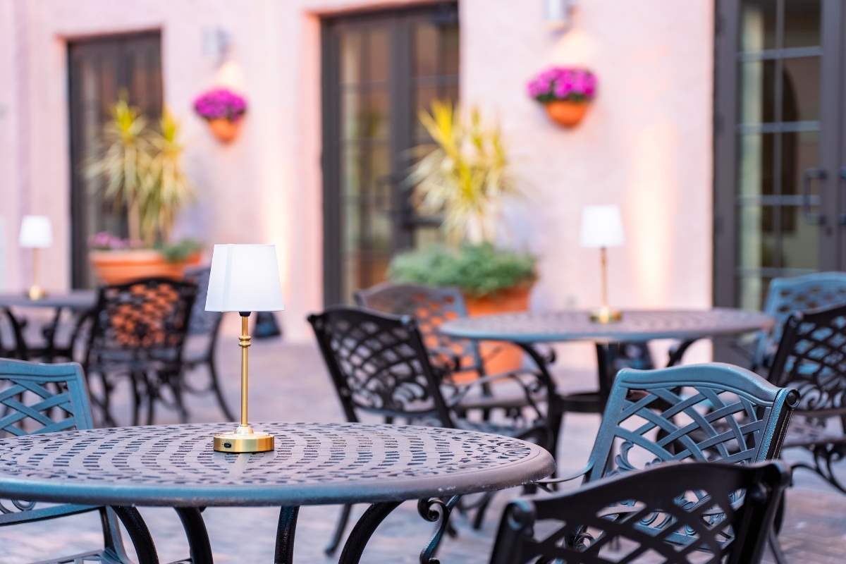 a table and chairs outside a building
