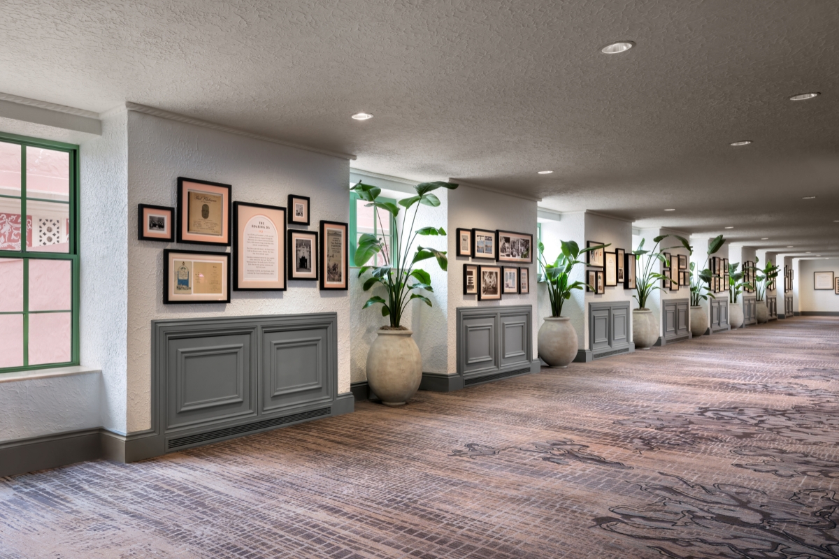 a long hallway with pictures on the wall