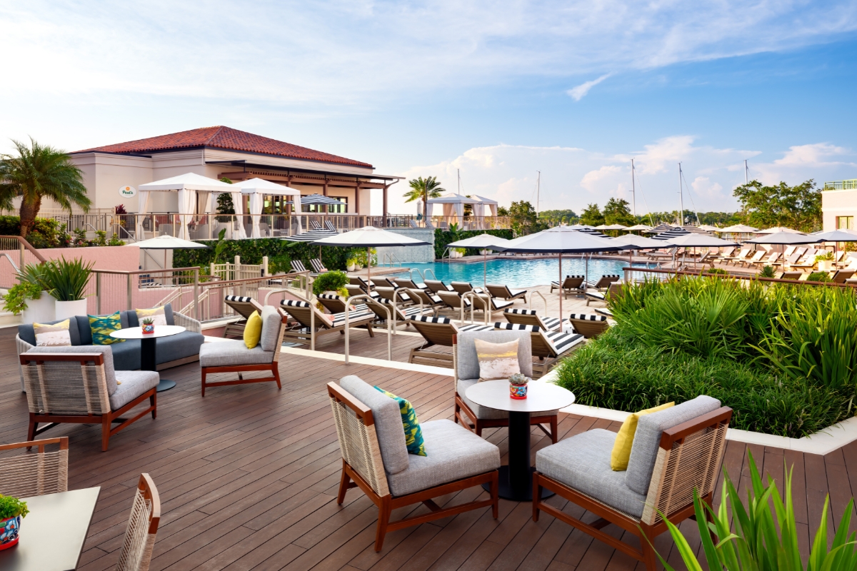 a pool with chairs and tables