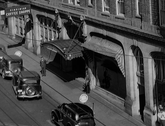 a street with cars and people on it