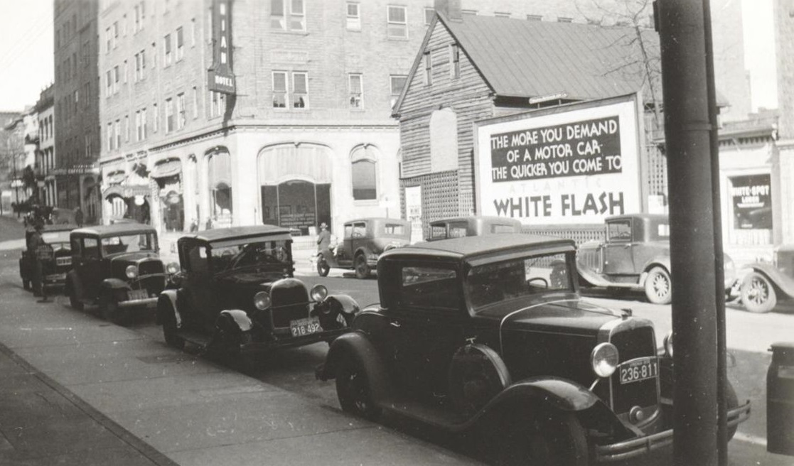 a group of cars parked on the side of a road