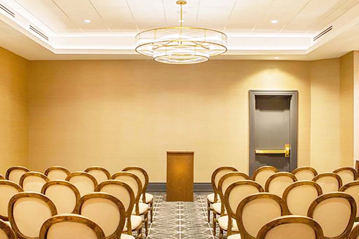 a room with chairs and a podium