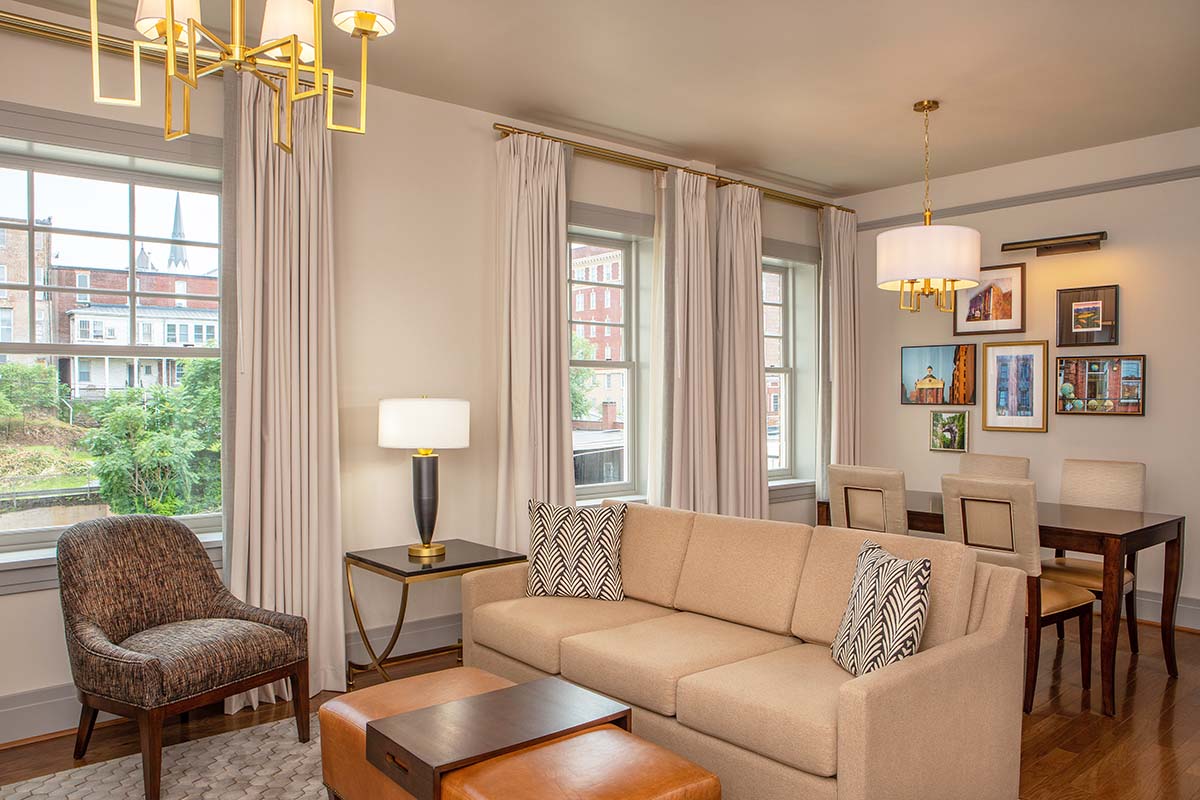 a living room with a couch and chairs