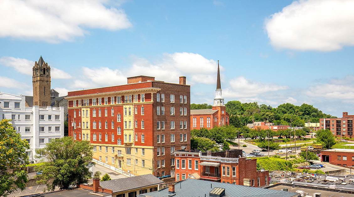 a building with a steeple in the background