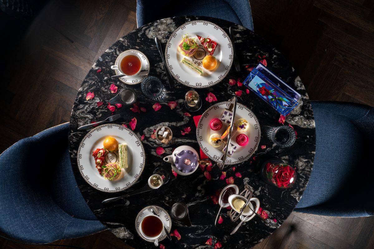 a table with plates of food and drinks