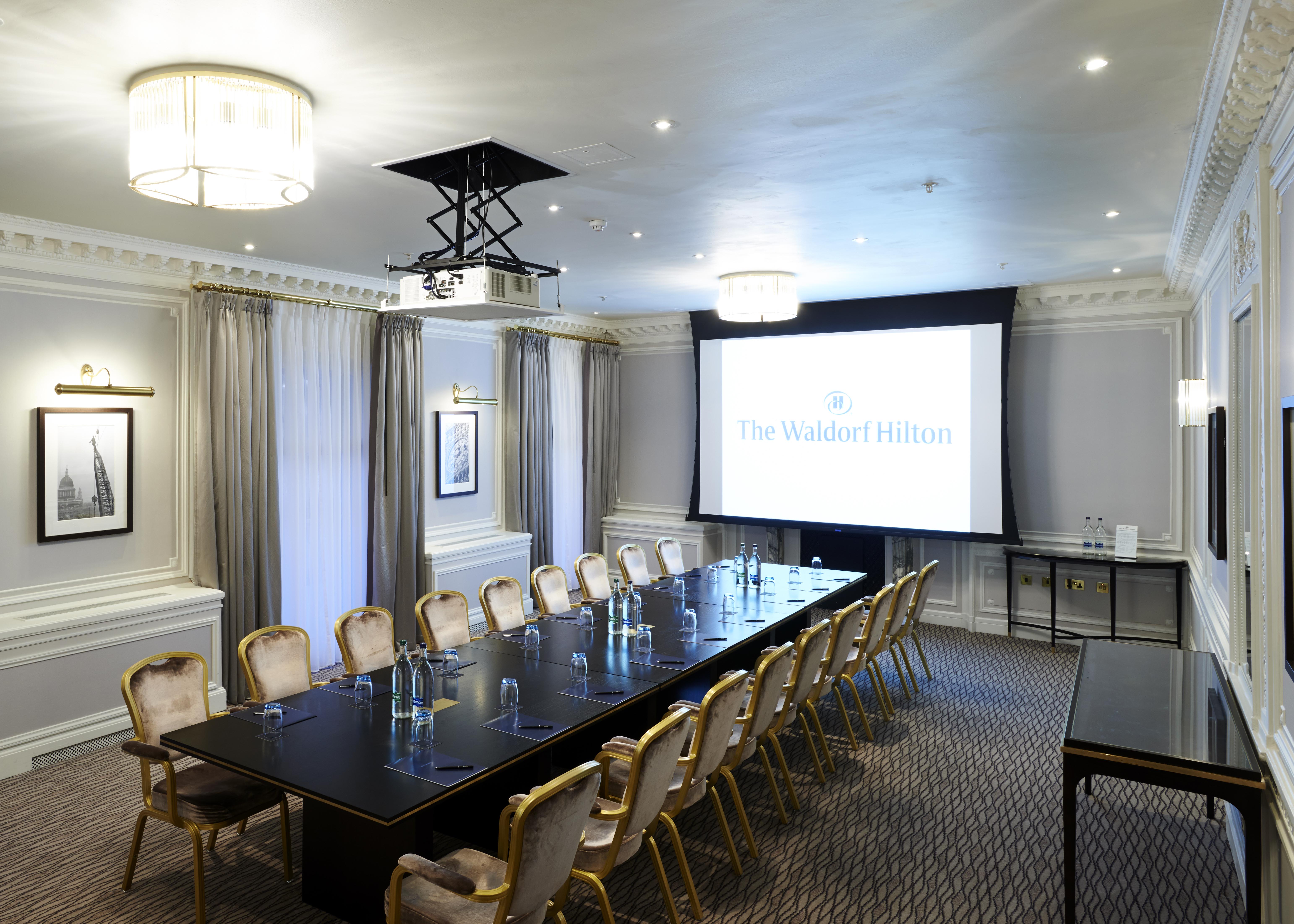 a conference room with a large table and chairs