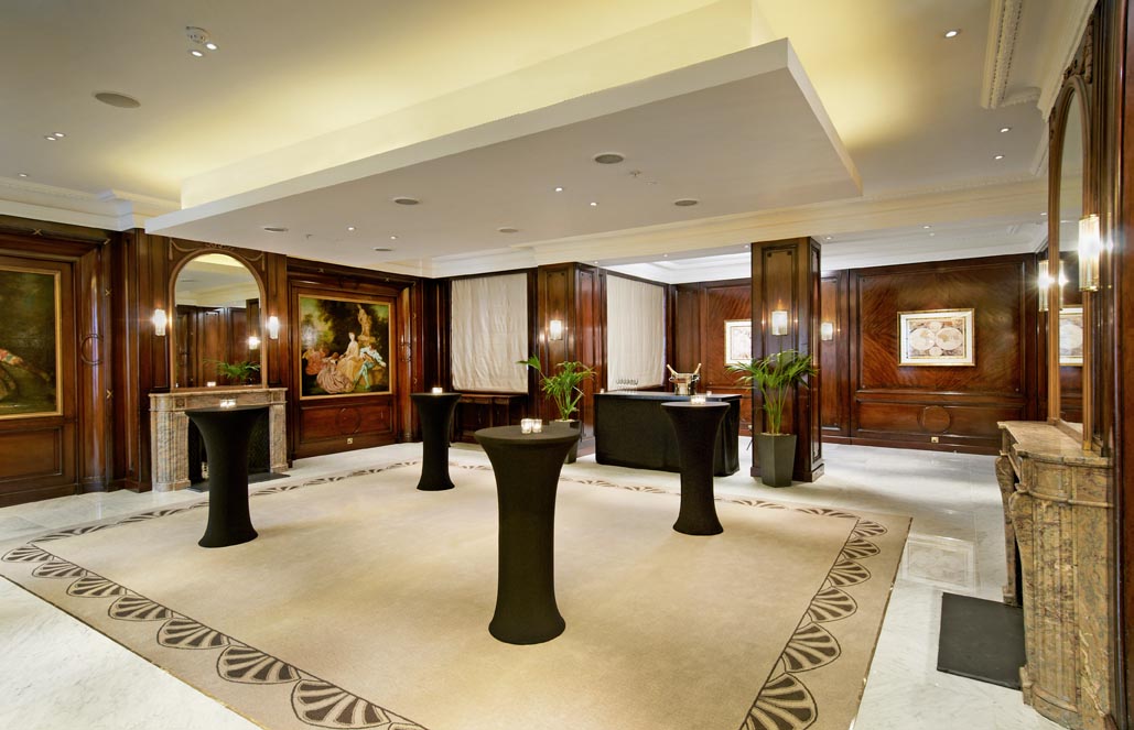 a room with tables and a table with candles