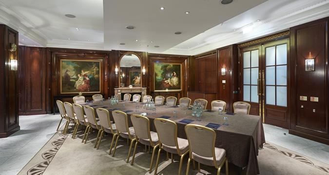 a long table with chairs in a room