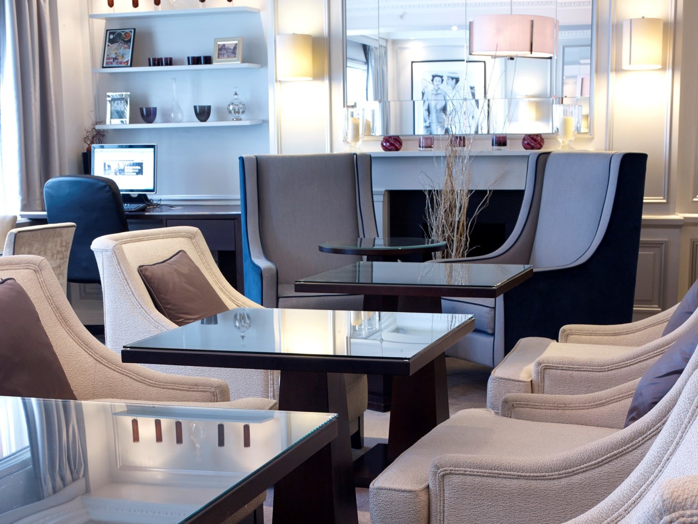a room with a couch and chairs