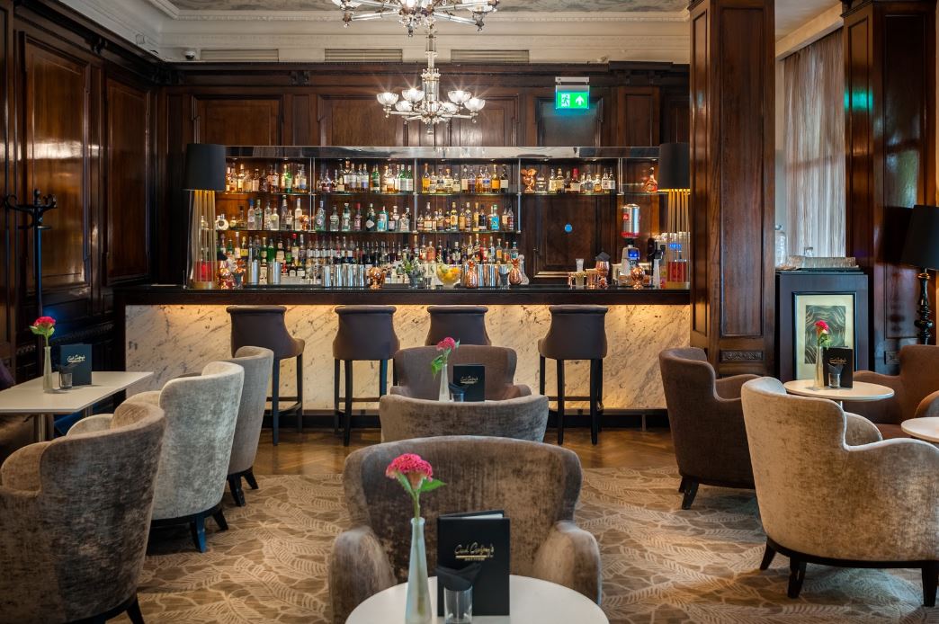 a bar with chairs and tables