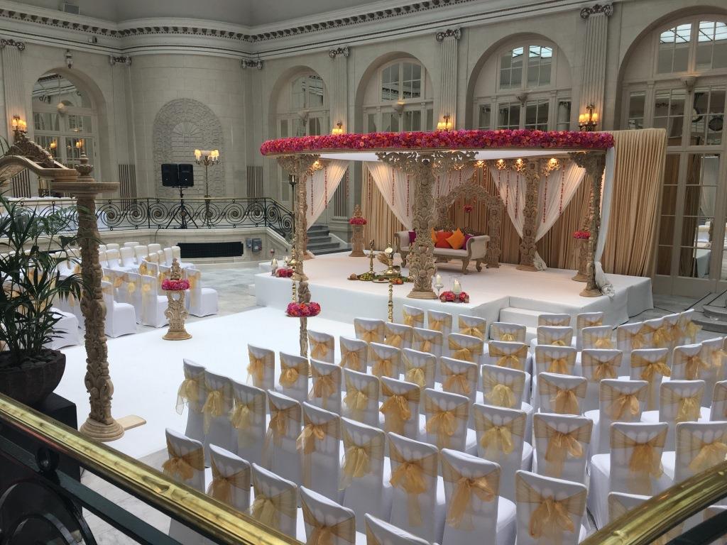 a wedding venue with chairs and a stage