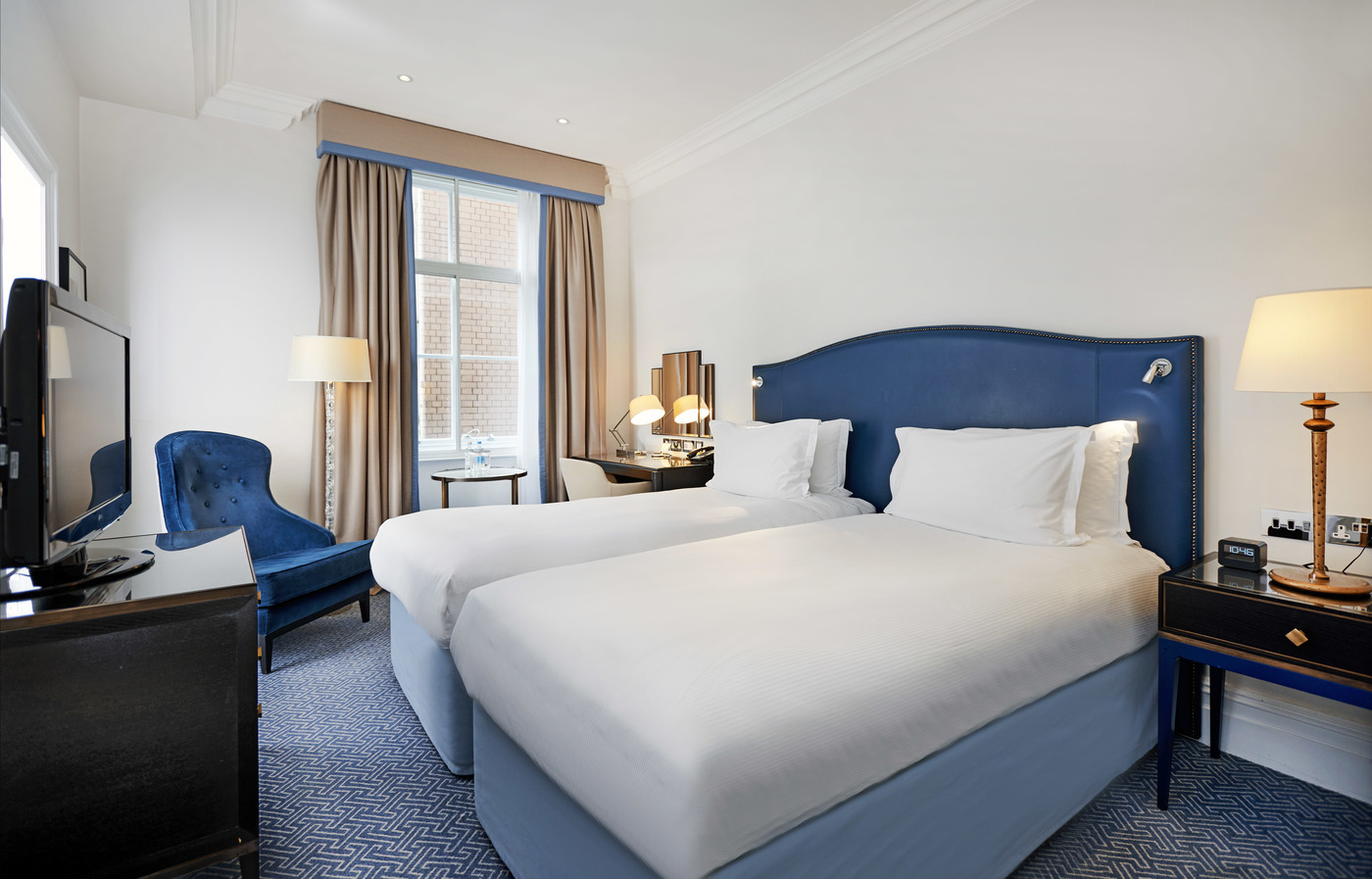 a hotel room with two beds