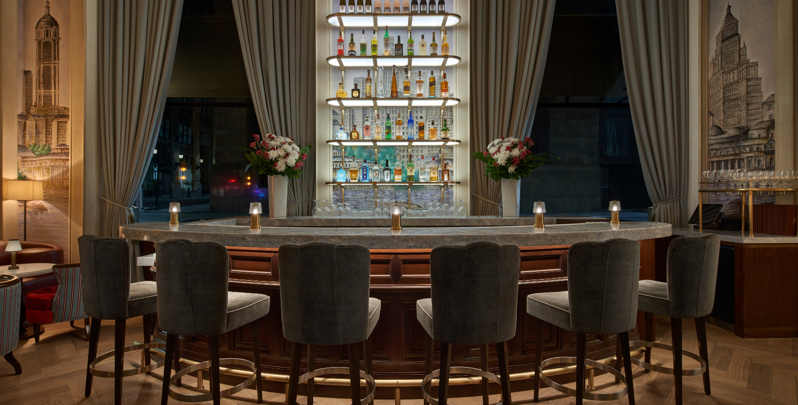 a bar with a shelf of liquor bottles