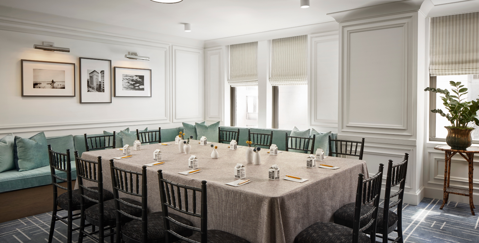 a table with a tablecloth and chairs in a room