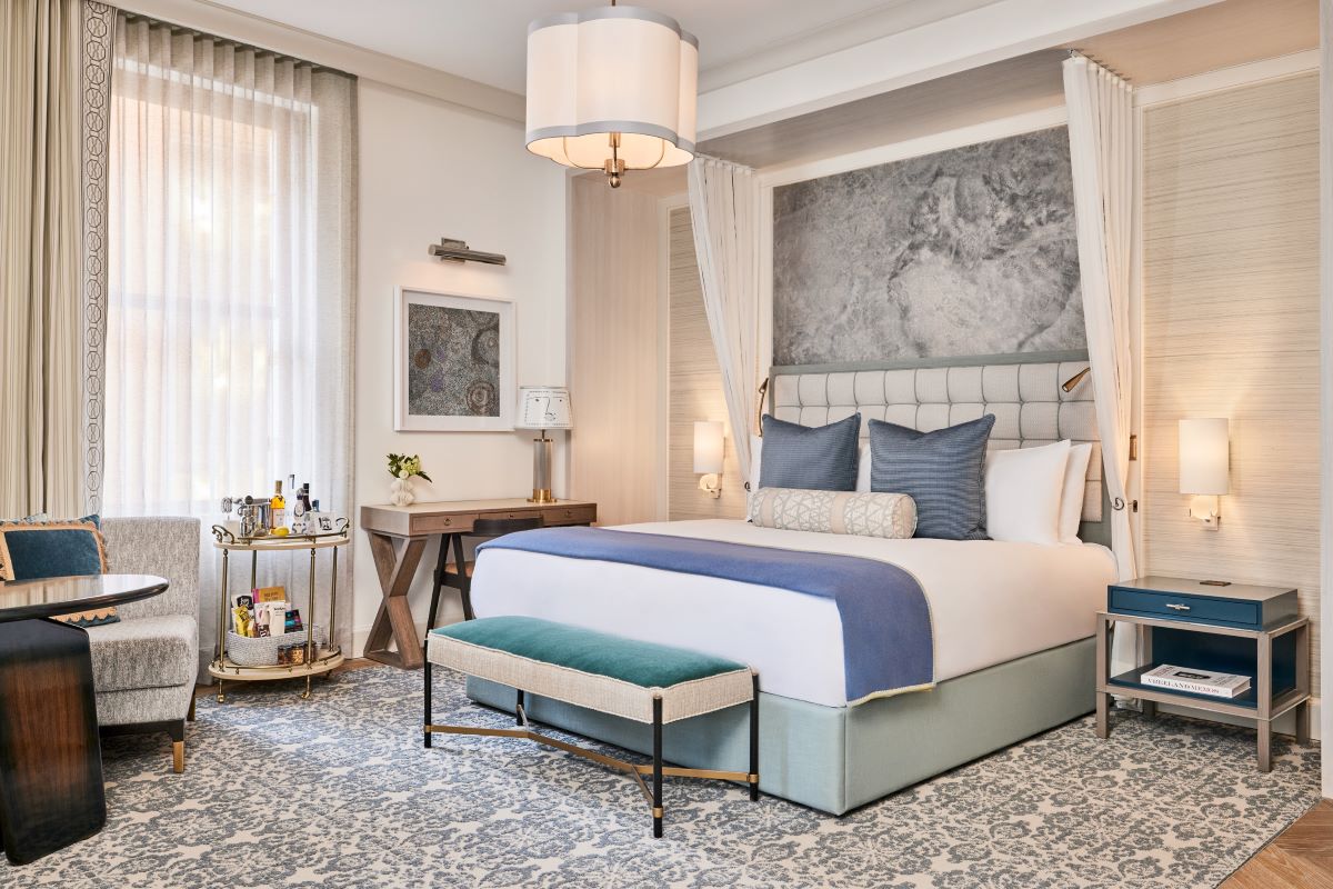 a bedroom with a bed and a table