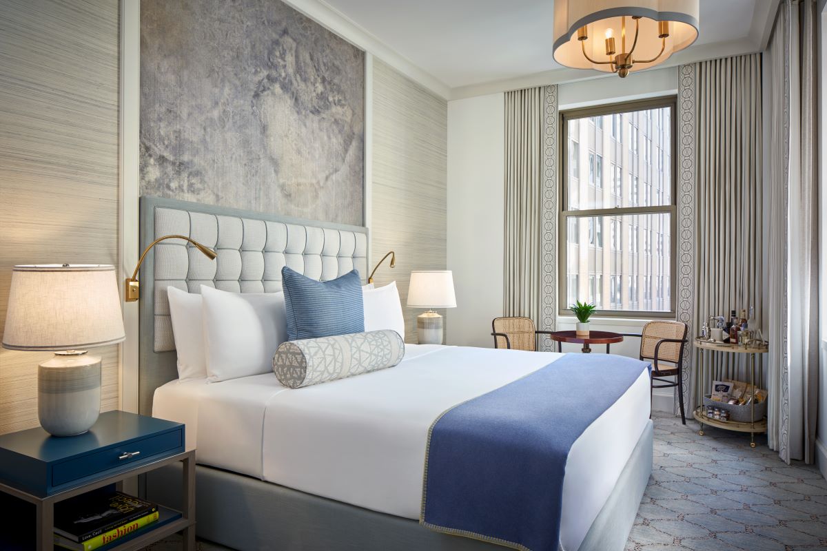 a room with a bed and a lamp