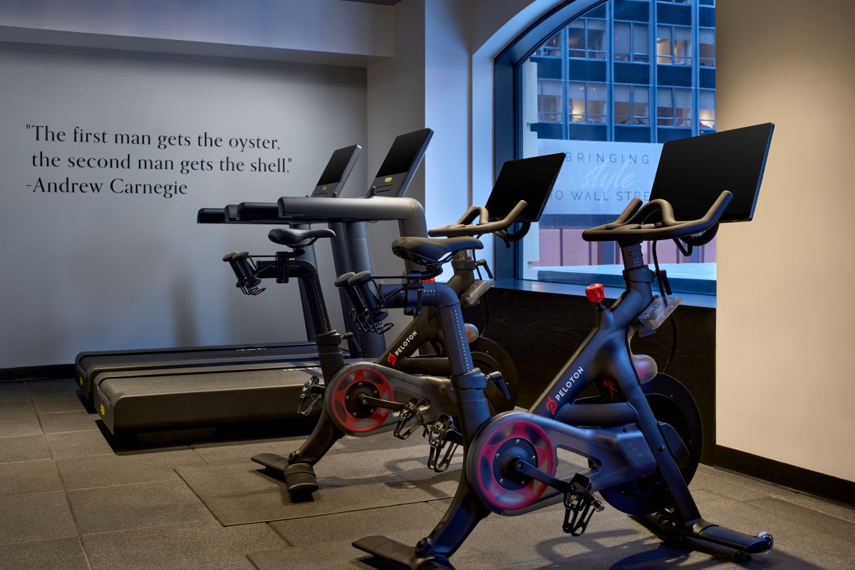 a group of exercise bikes in a room