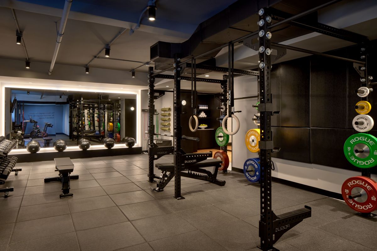 a gym with weights and equipment