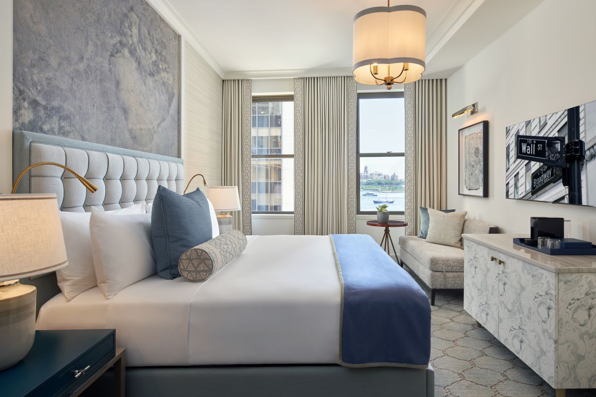 a bedroom with a bed and a chair