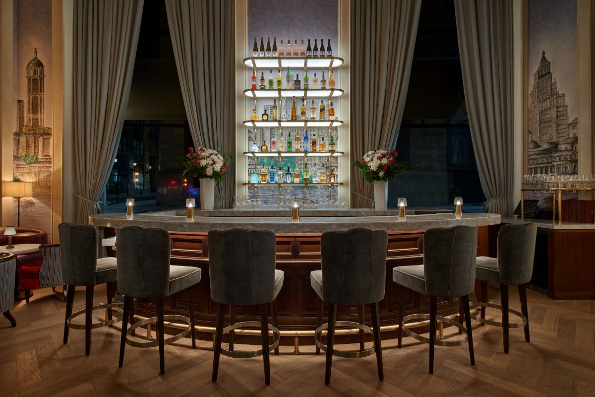 a bar with a shelf of bottles