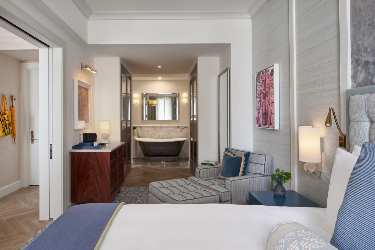 a room with a bed and a bathtub