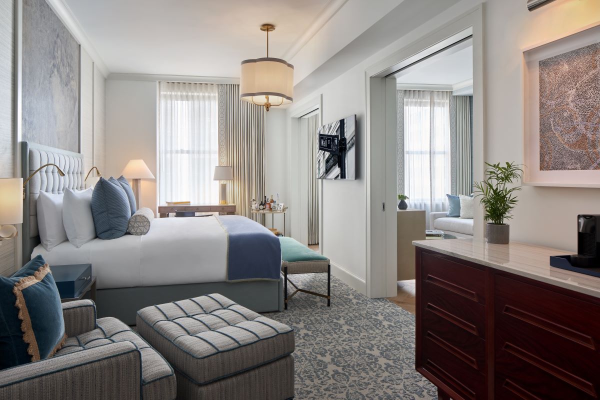 a bedroom with a bed and a table
