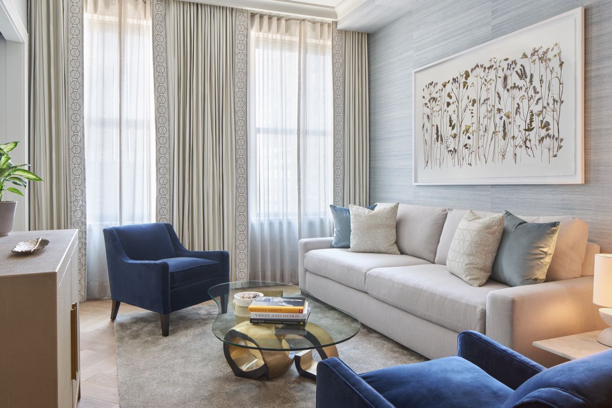 a living room with a couch and chairs