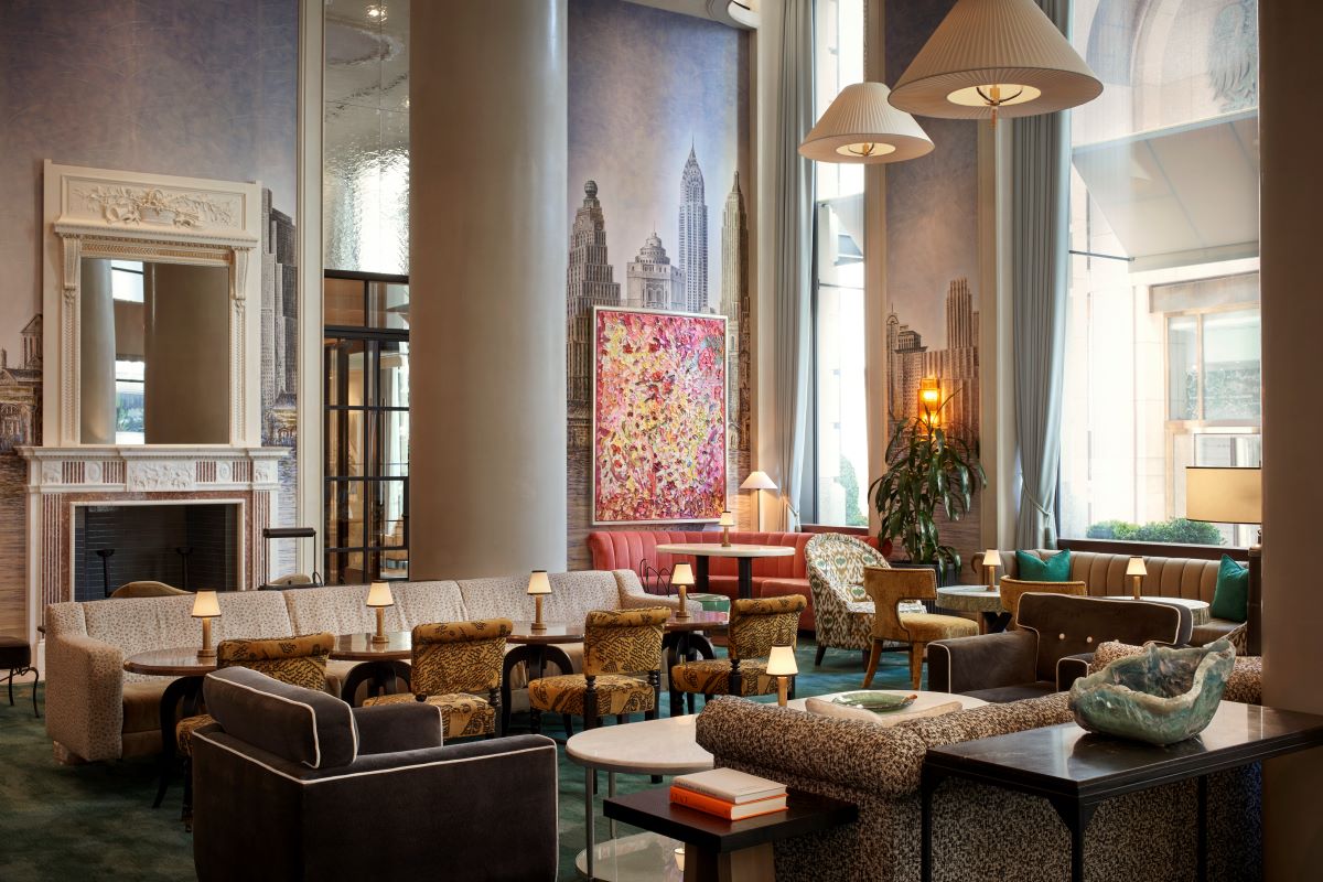 a large room with a large wall and a large painting