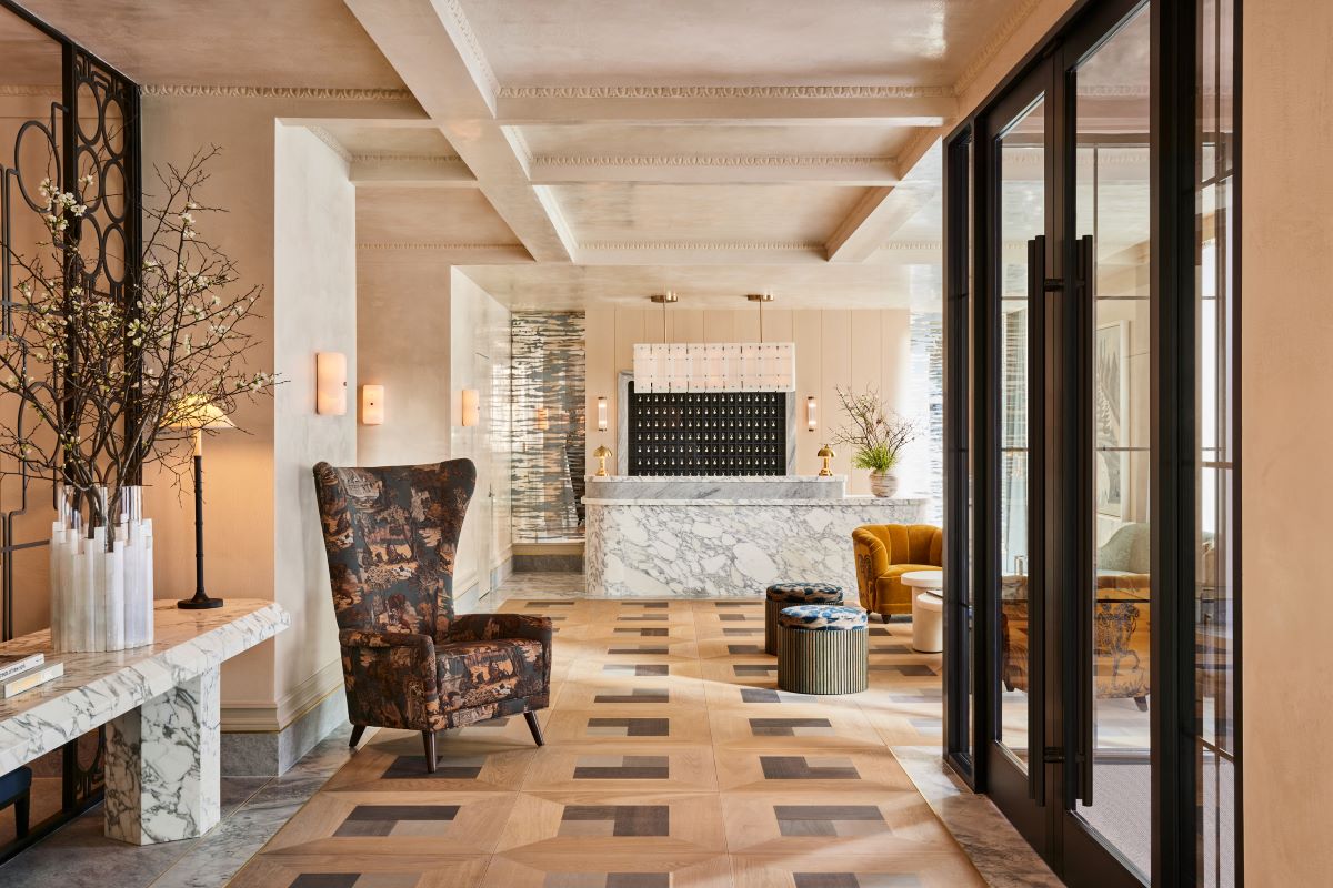 a lobby with a chair and a table