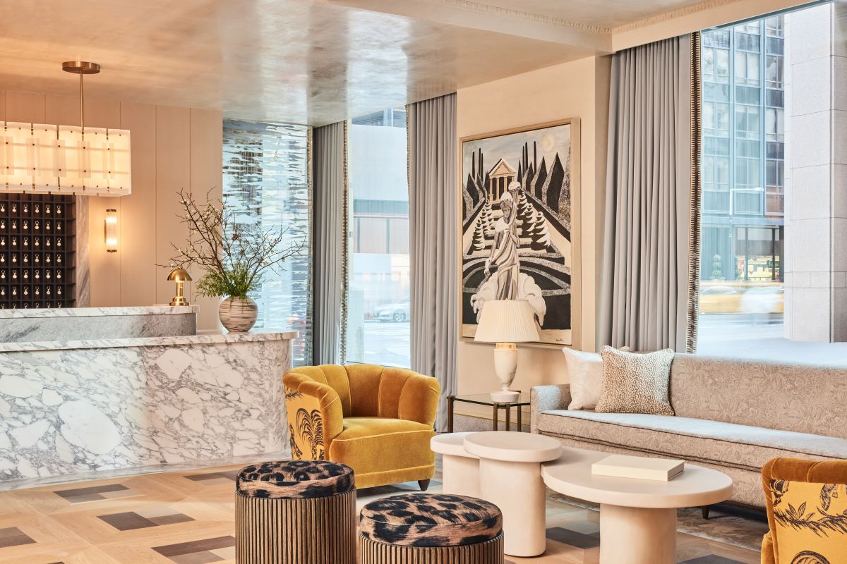 a room with a couch and chairs