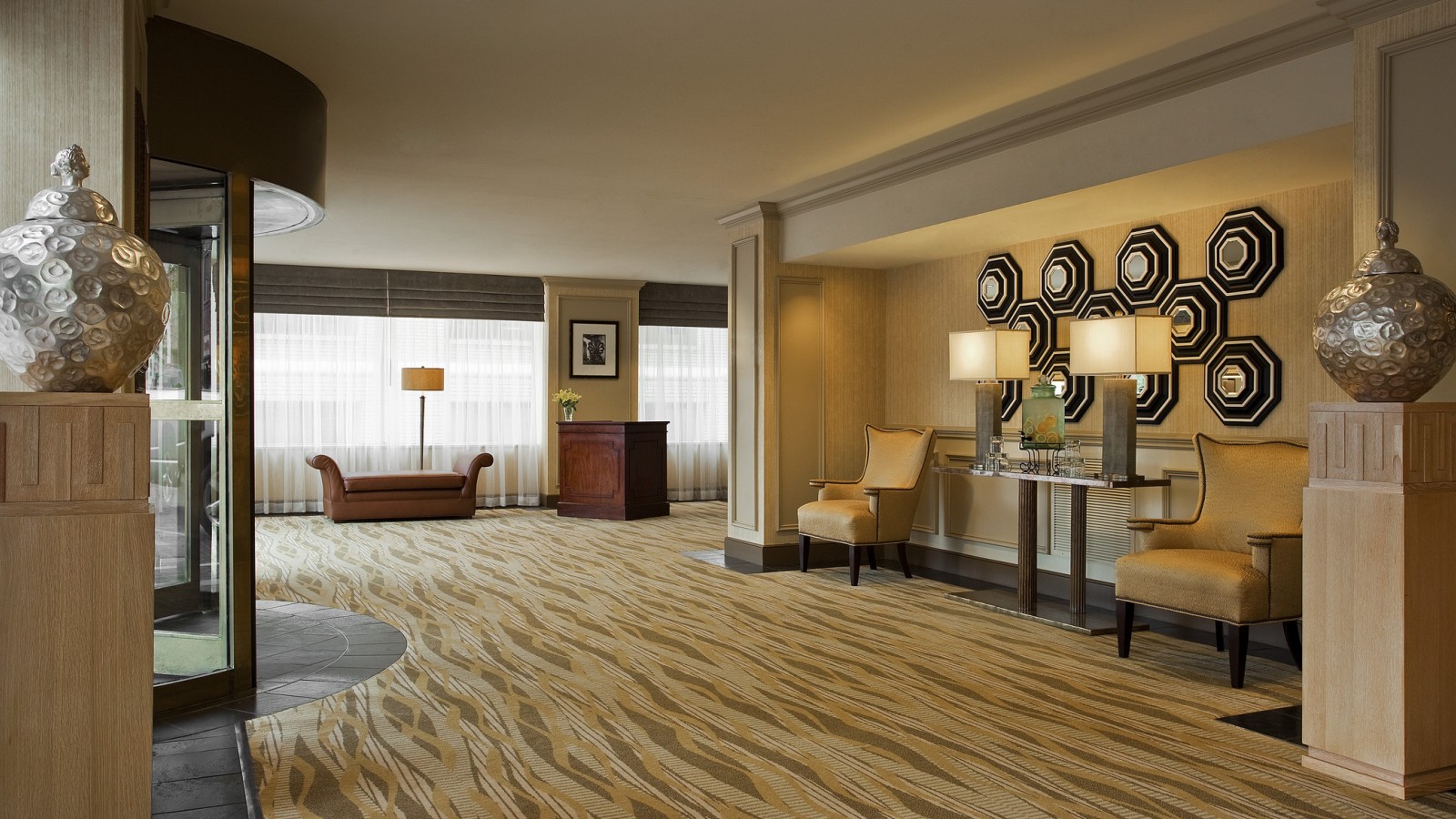 a room with a fireplace and chairs