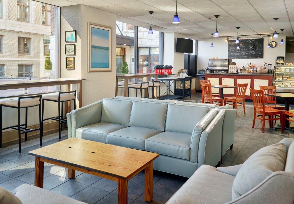 a room with couches and tables