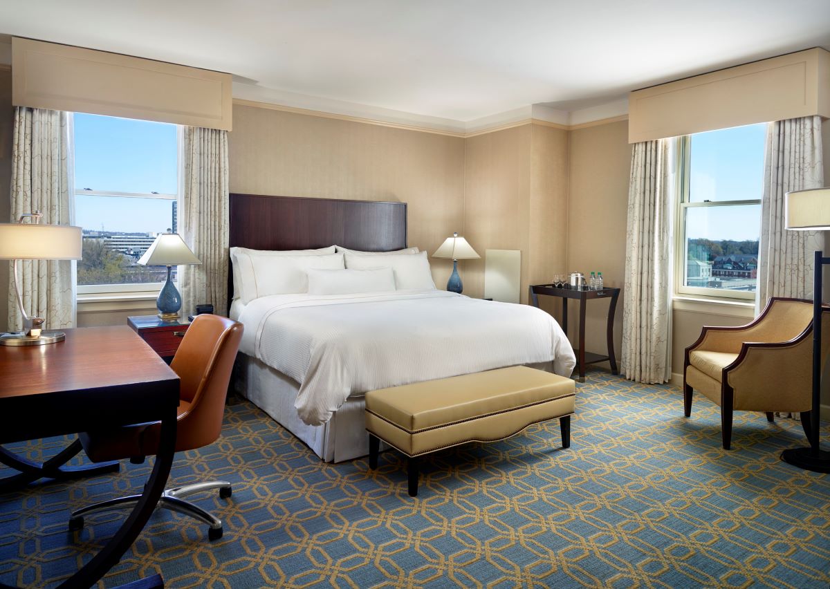 a room with a bed and a desk