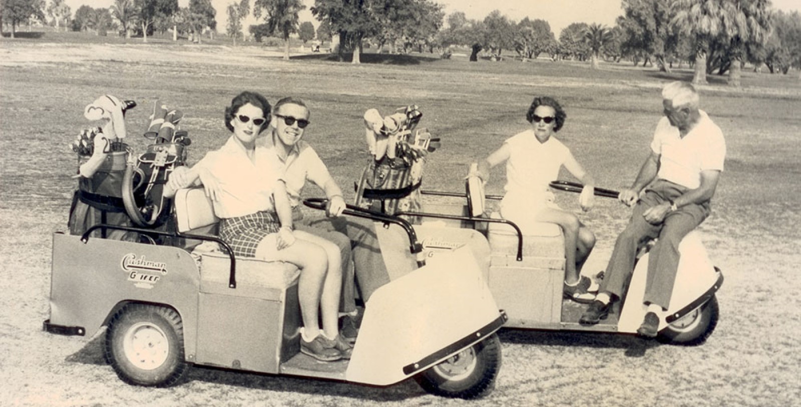 a group of people on a golf cart