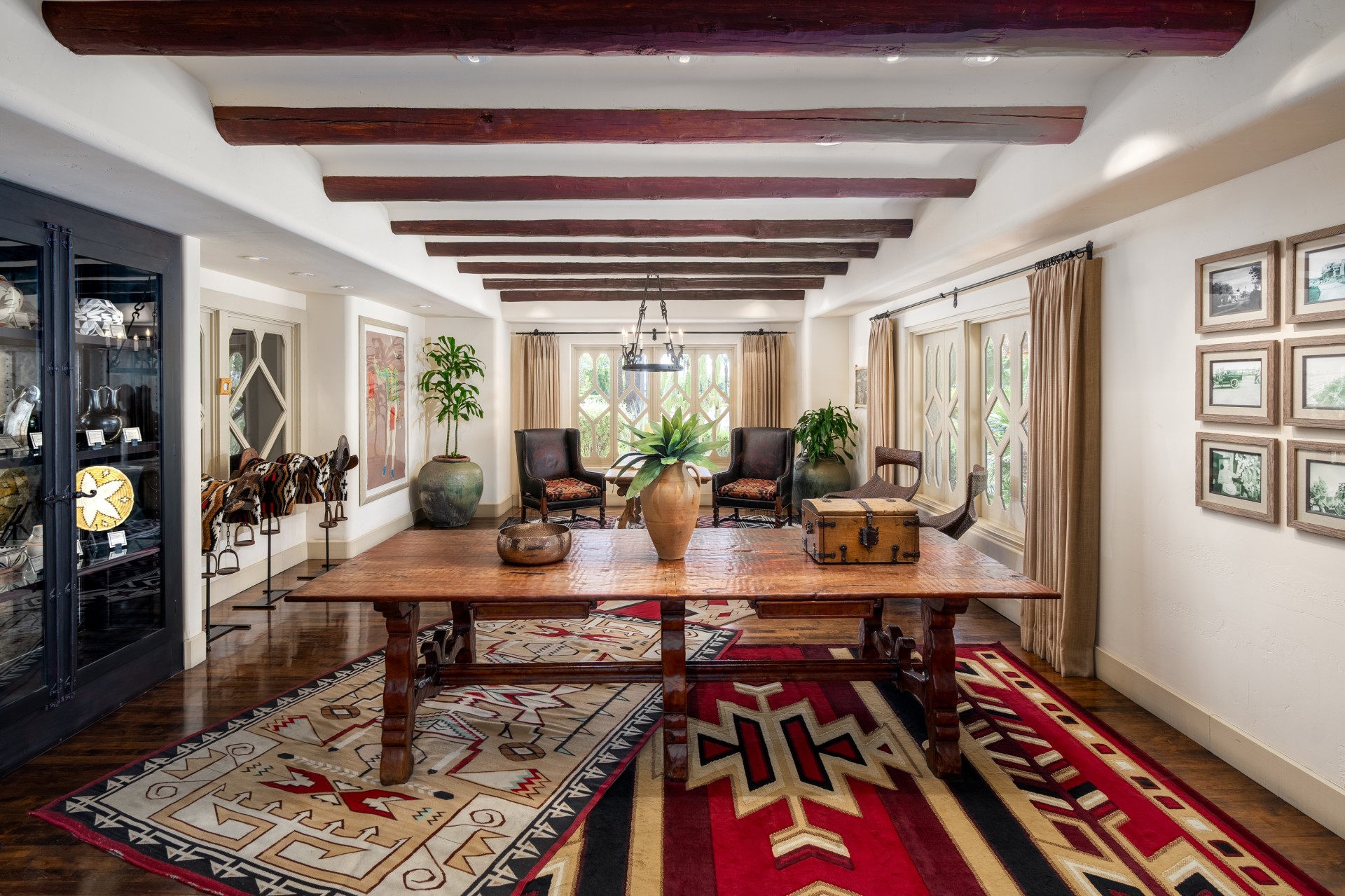 a room with a large table and chairs