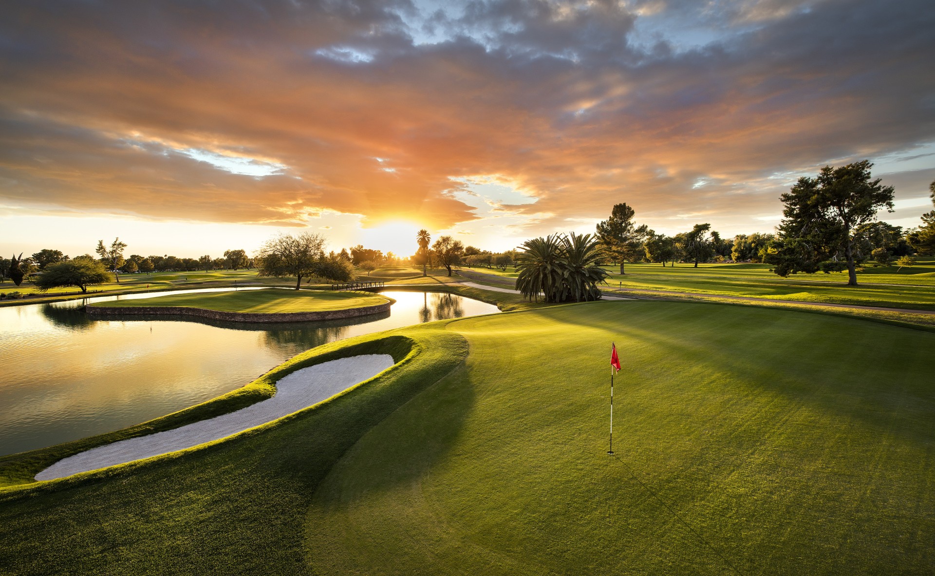 a golf course with a flag on the green