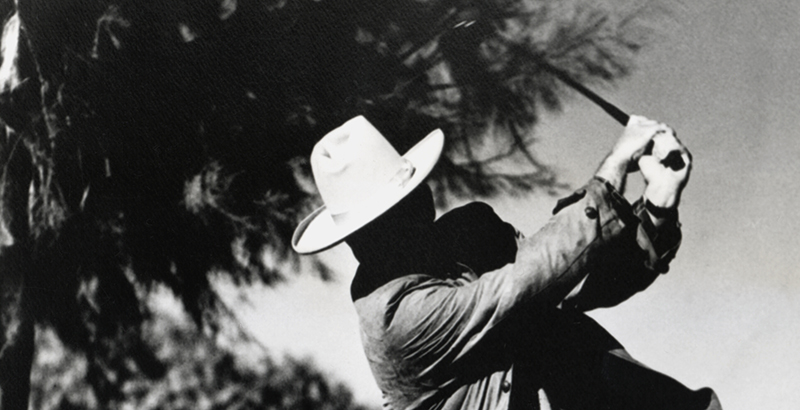 a man swinging a golf club