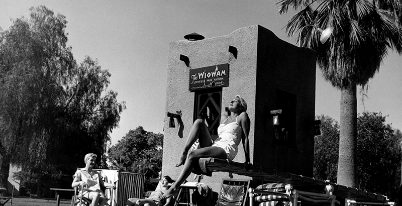 a woman sitting on a platform