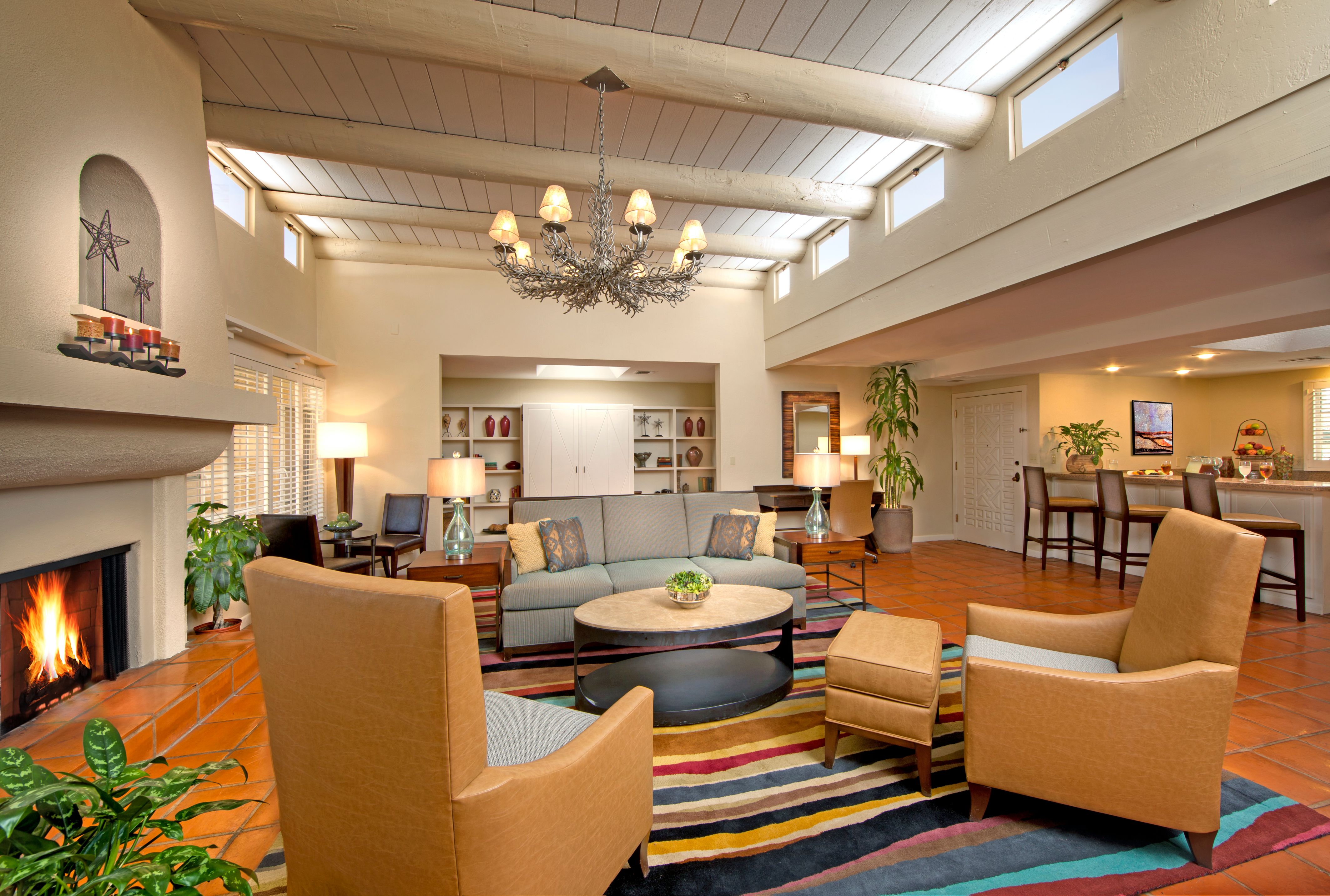 a living room with a couch and chairs