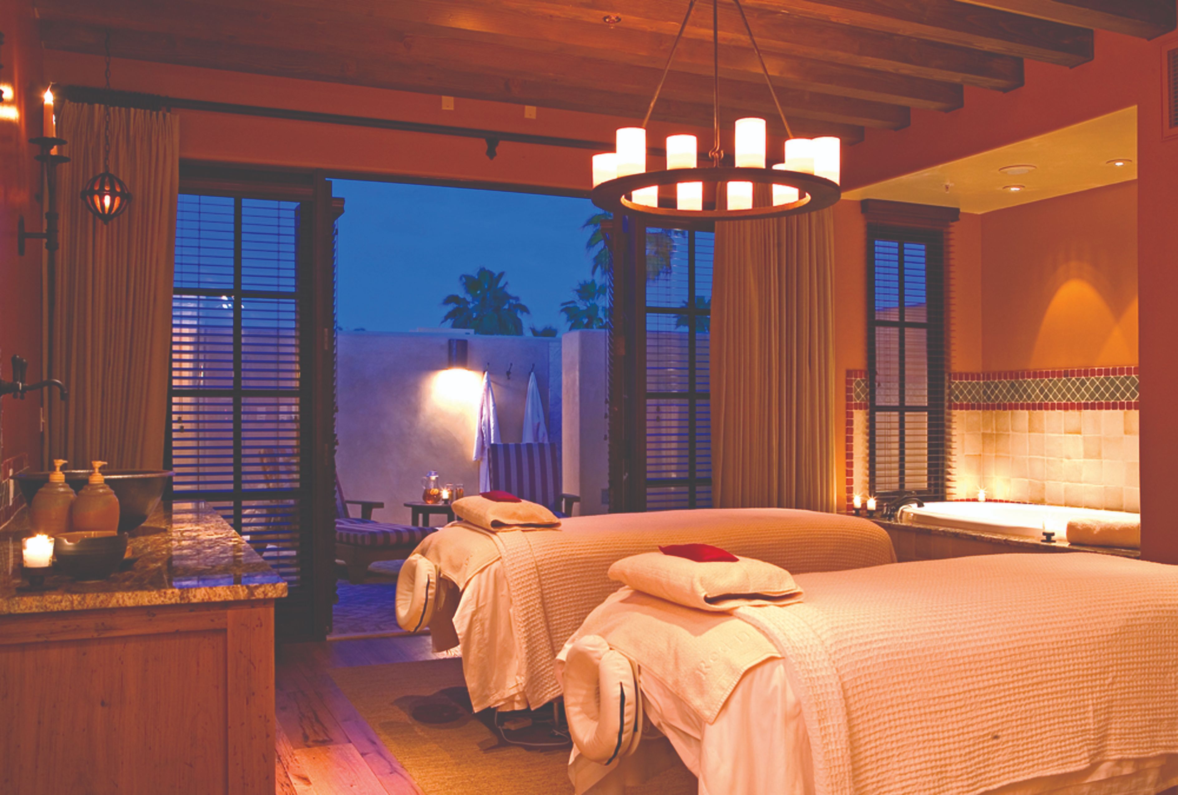 a room with two beds and a jacuzzi
