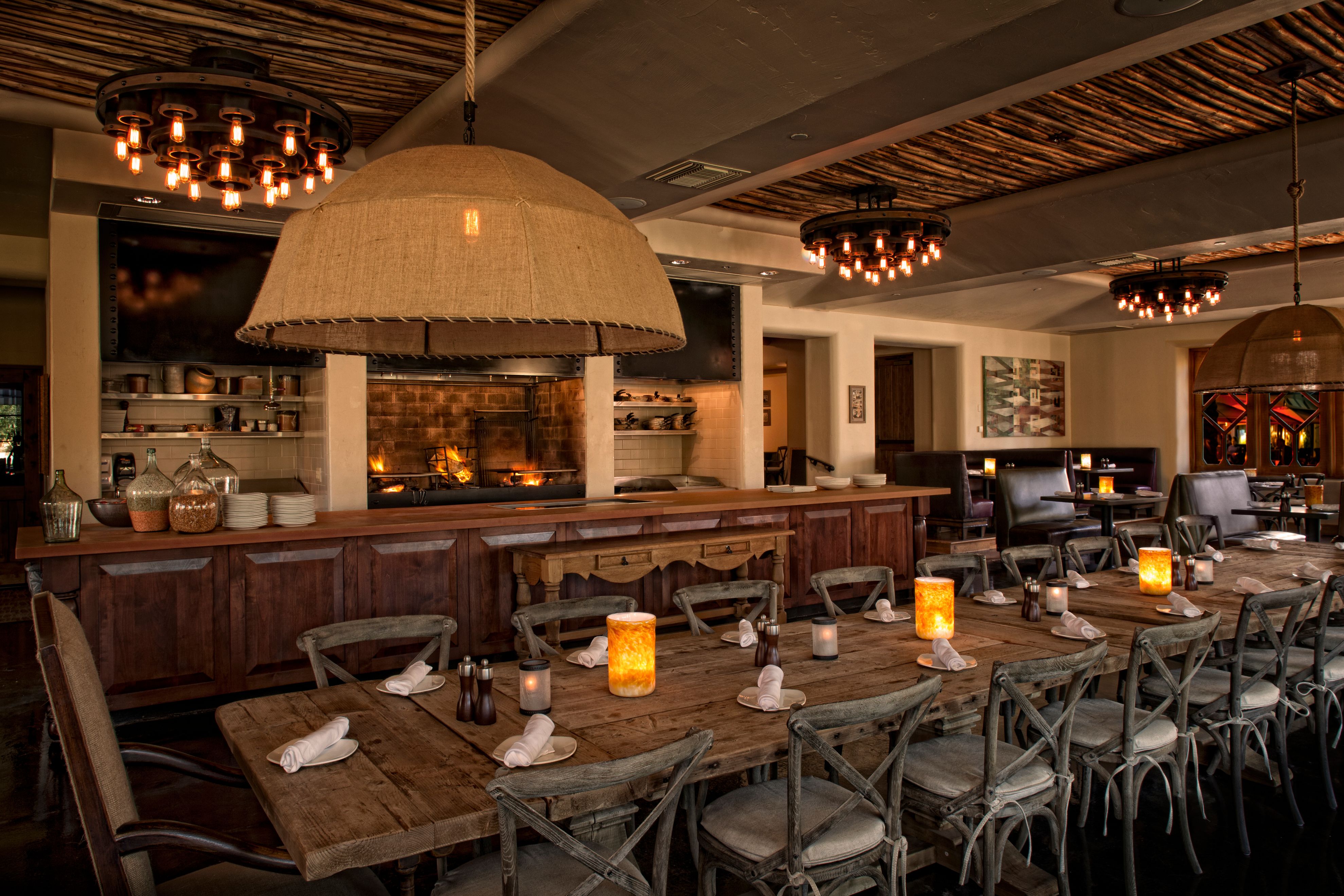 a large dining room with a large table and chairs