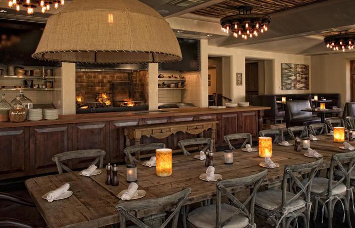 a large dining room with a large fireplace