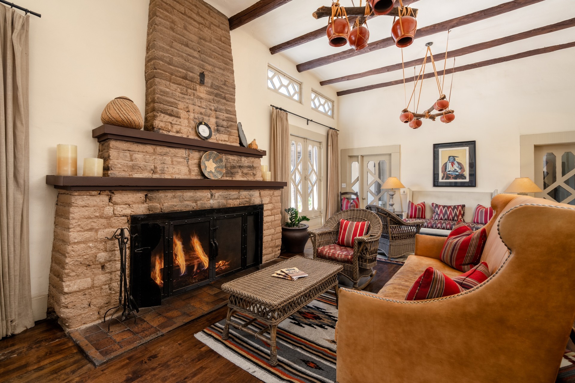 a living room with a fireplace and couches