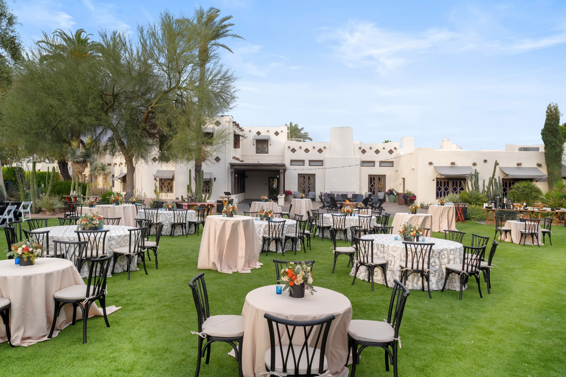 a group of tables and chairs outside