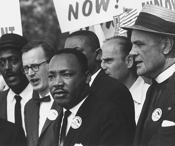 a group of men standing in a row