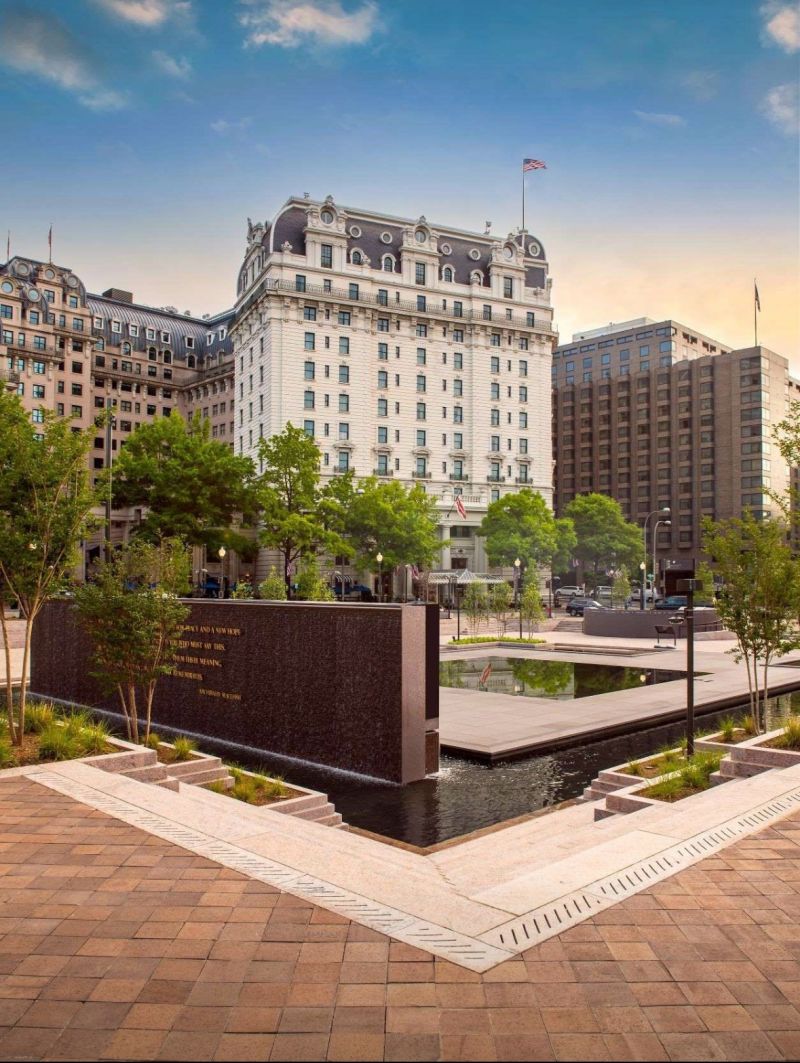 a building with a fountain in front of it