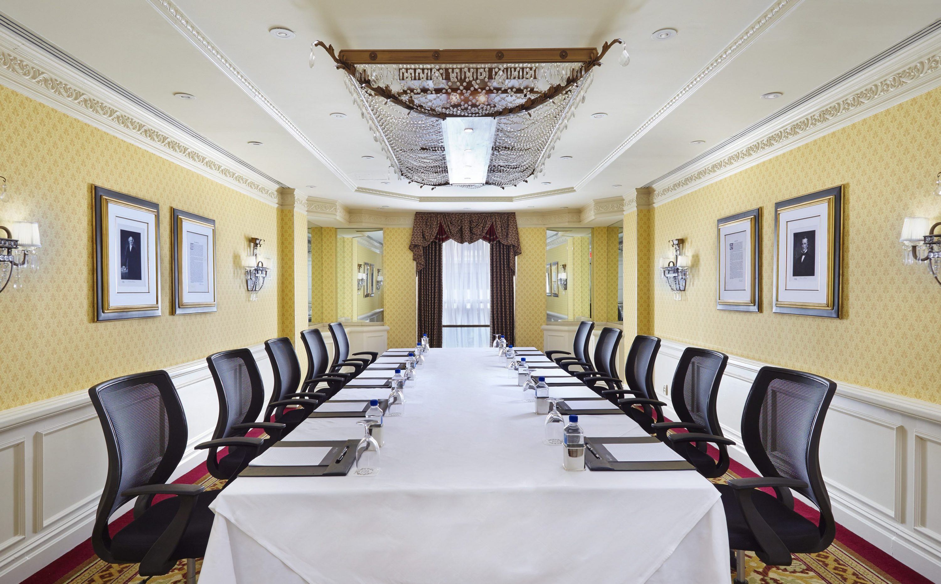 a long conference room with chairs and tables
